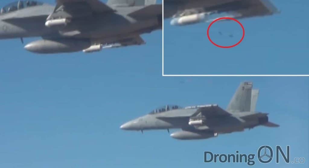 A still from the footage in which the drones can be seen whilst deploying from the F/A18 Jet.