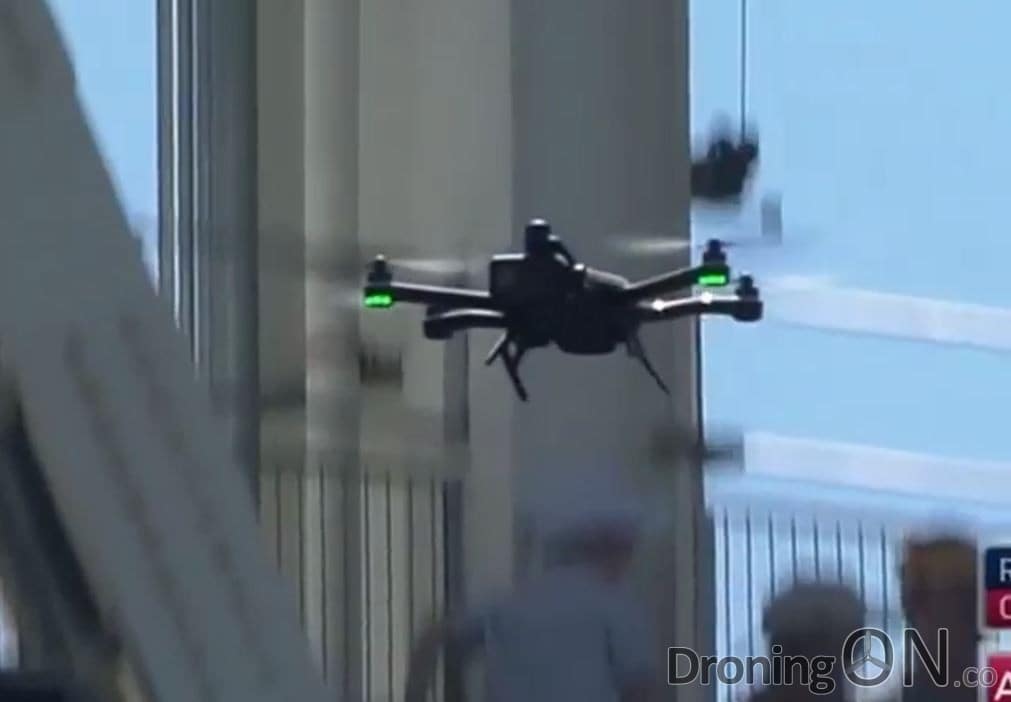 The GoPro Karma drone is initially spotted hovering around the stadium at fairly high altitude.