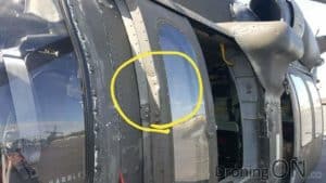 Photo from ar15.com showing the dent to the helicopter window frame.